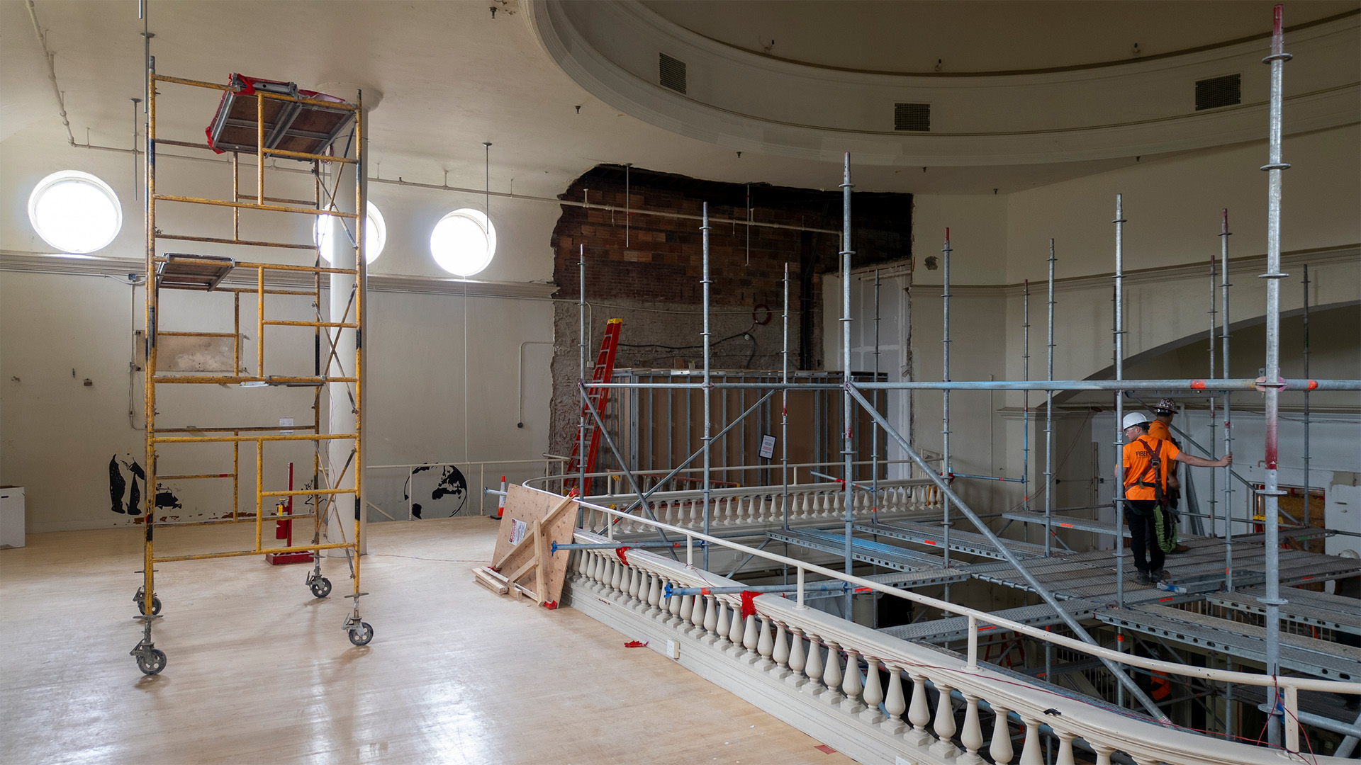 an interior view of a domed building under construction