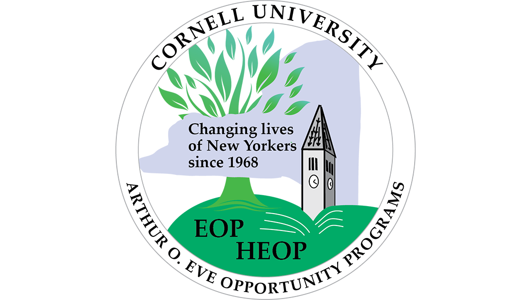 A seal logo with black text a green tree and a grey clocktower.