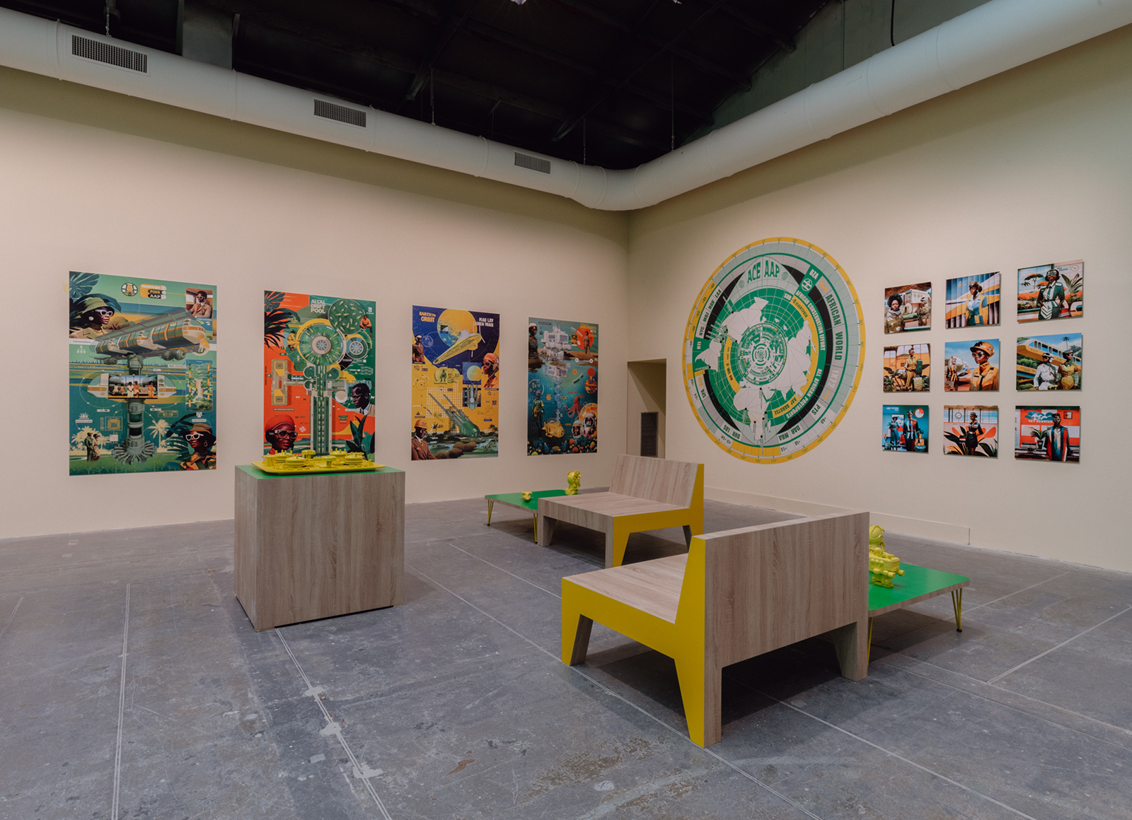 https://aap.cornell.edu/Fictional%20waiting%20lounge%20featuring%20bright%20green%20tables%2C%20yellow%20sculptures%2C%20and%20hung%20travel%20posters