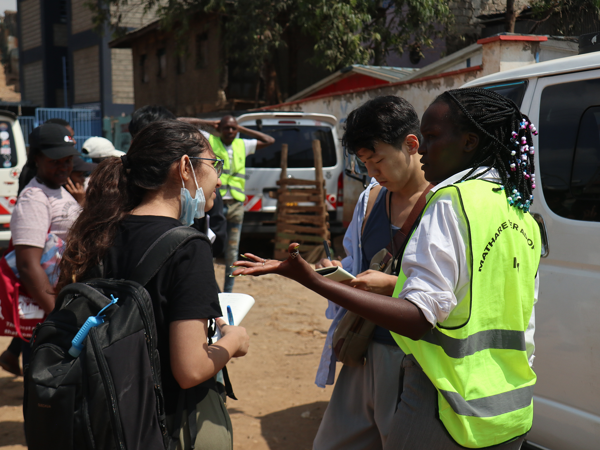 https://aap.cornell.edu/Students%20interviewing%20a%20woman%20wearing%20a%20neon%20vest%20on%20a%20street%20corner