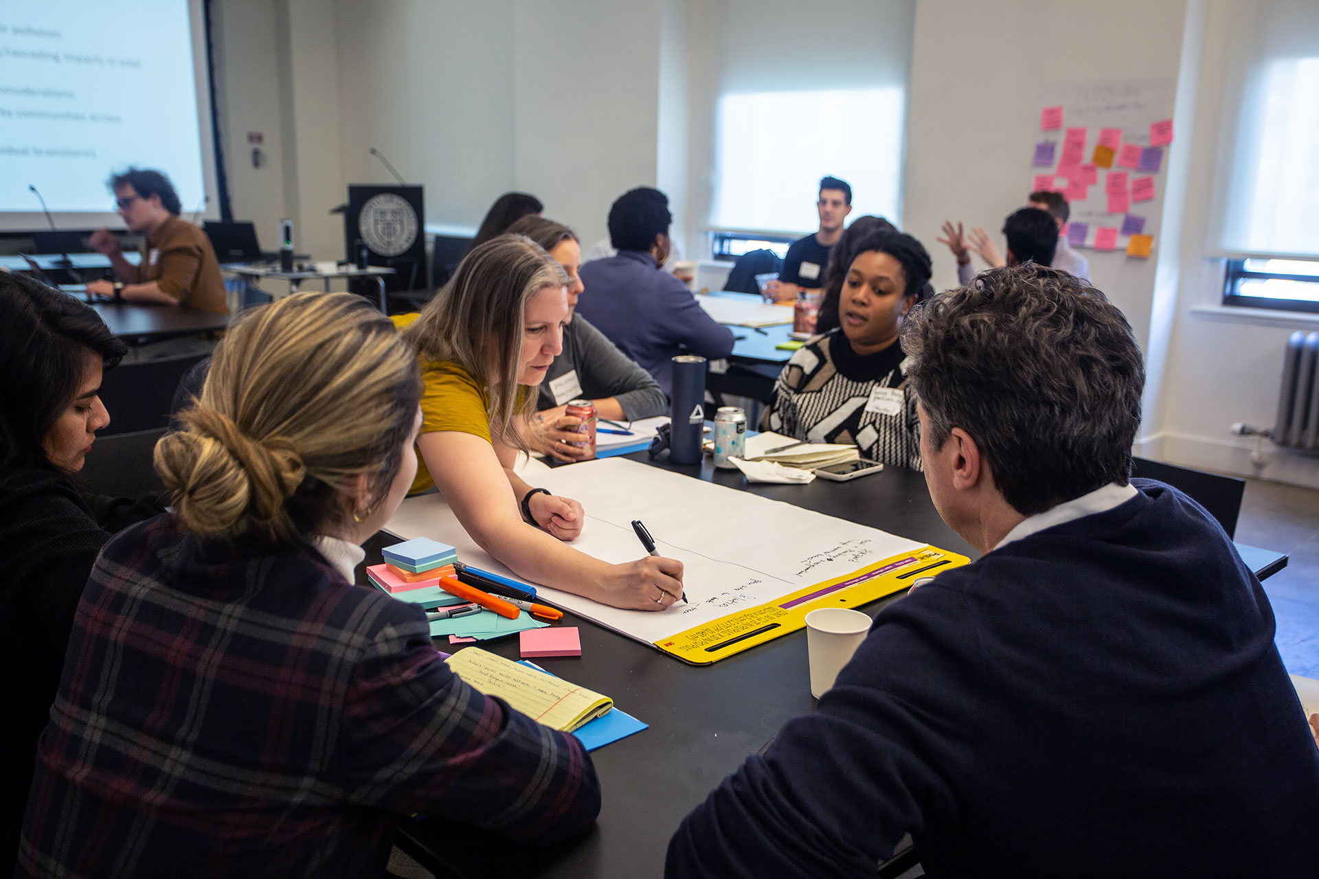 People gathered around a table in a workshop session