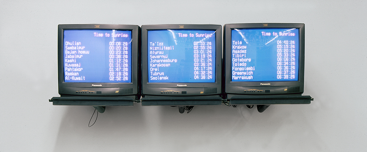 three monitors side by side with blue screens and white text