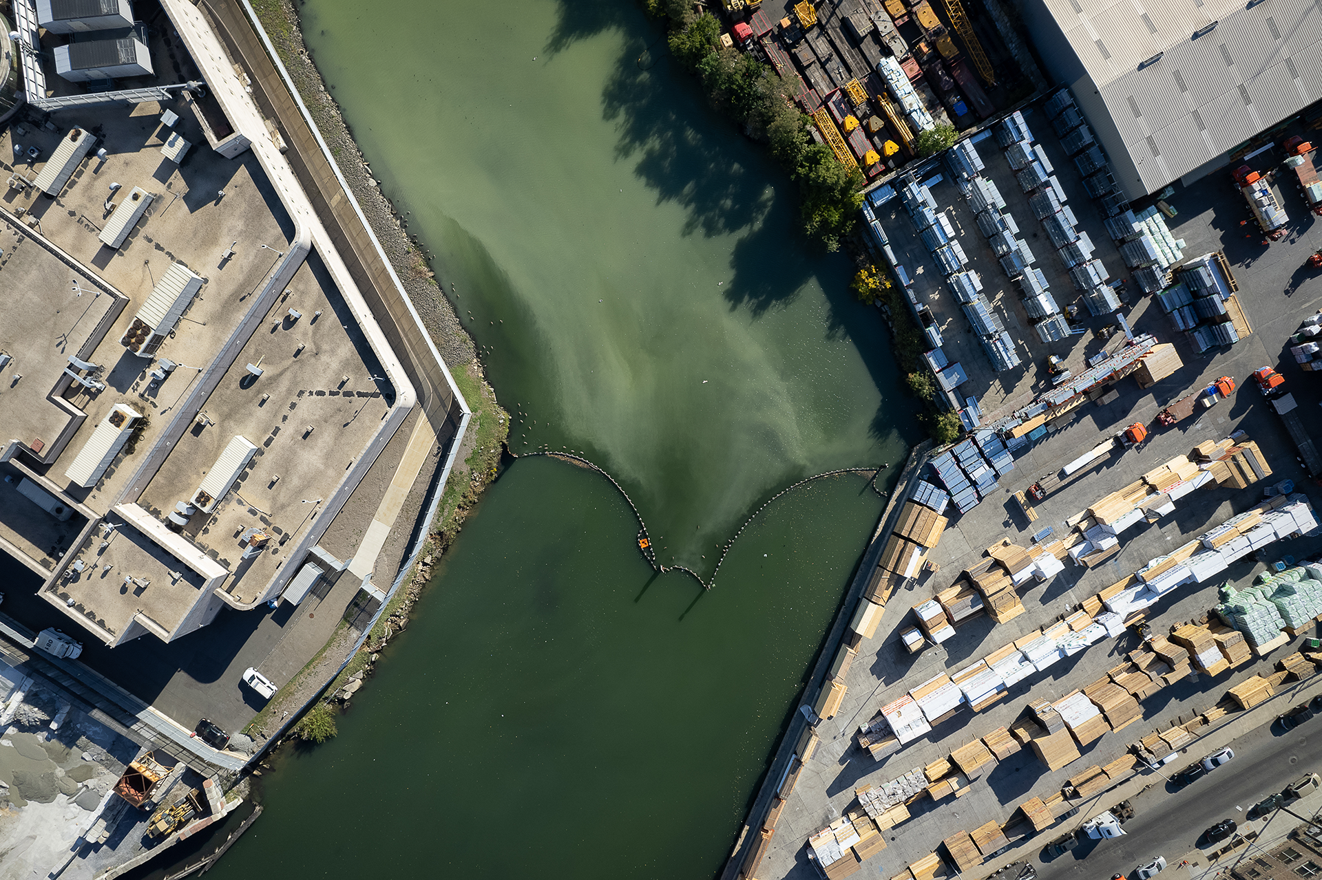 Aerial view of urban zone with canal running through center.