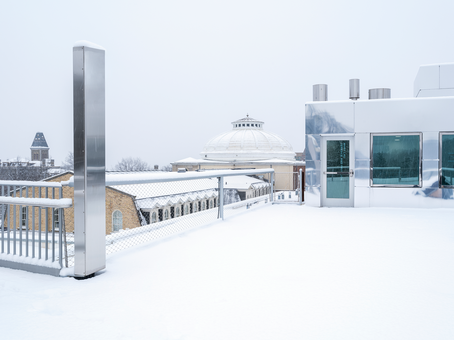 View across campus from a snow-covered rooftop.