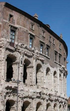 a curved and colonnaded facade of an ancient building