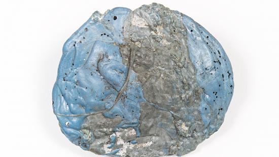 Spherical lump of blue material infused with grey metal.