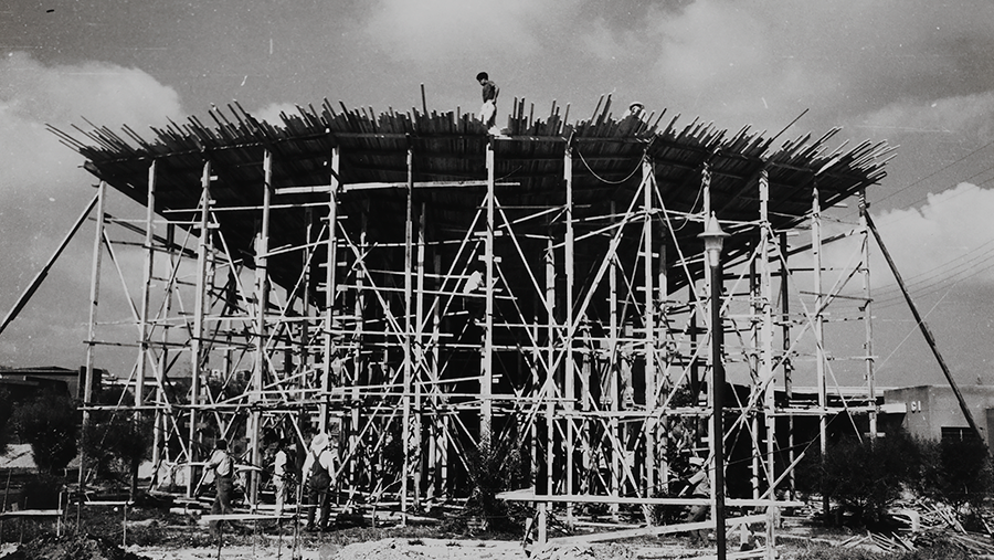 Wood formwork under construction with workers visible