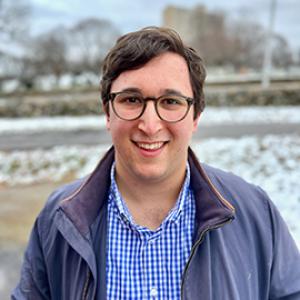 smiling man wearing glasses