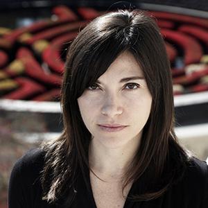 A woman with dark brown hair and a black shirt