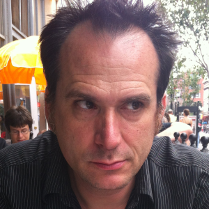 white man with receding dark hair