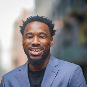 smiling man with suit jacket on