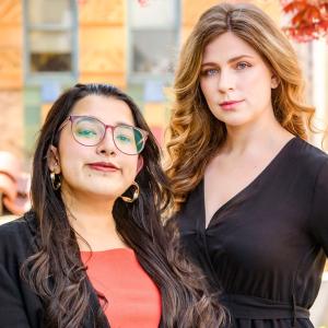 two women posing for a professional photo