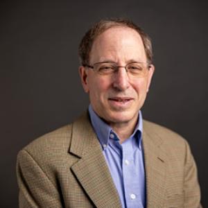 man with eyeglasses, collared shirt and jacket 