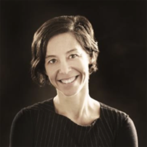 sepia tone photo of woman with short hair and sweater
