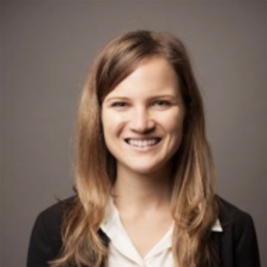 woman with long brown hair white shirt