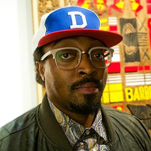 headshot of an African American man wearing a baseball cap with a D on it