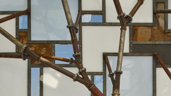 Rusty metal pipes in front of blue and white glass panes.