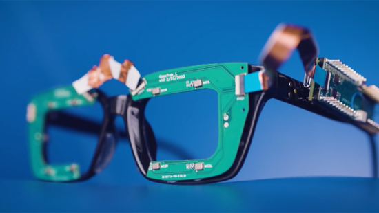 Green eyeglass frames with computer chips attached.