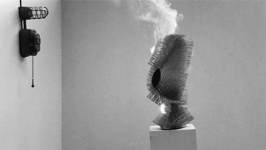 Abstract sculpture burning on a pedestal