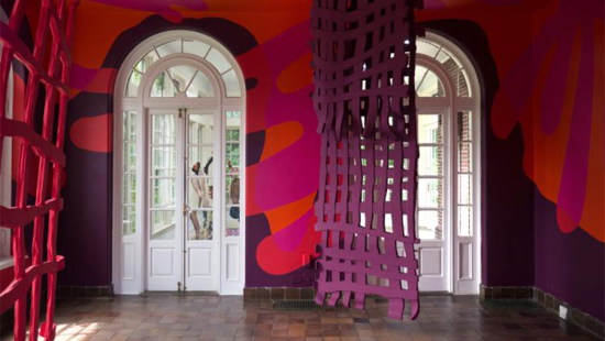 Brightly painted room with two French doors