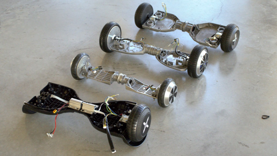 Four hoverboards in a row stripped for parts.