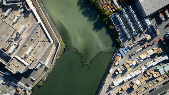 Aerial view of urban zone with canal running through center.