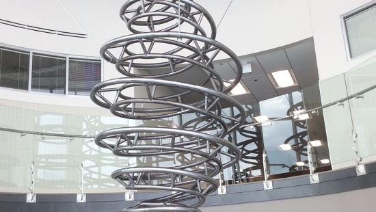 Steel creates a spiraling vortex in this 14-foot sculpture suspended with cables from the ceiling. 