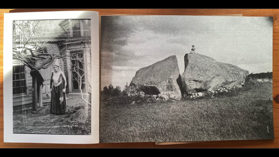 Two old photographs on the opened pages of a book.