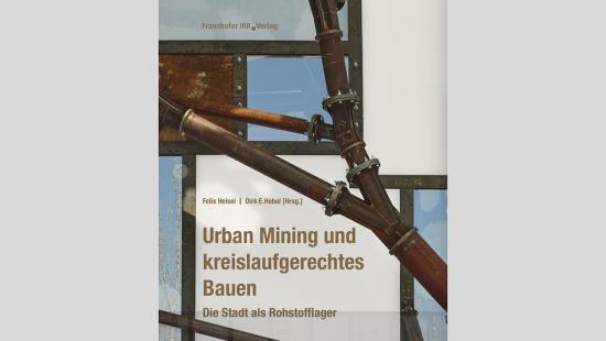 Metal pipes, geometric shapes colored white, blue, and brown, with brown text.