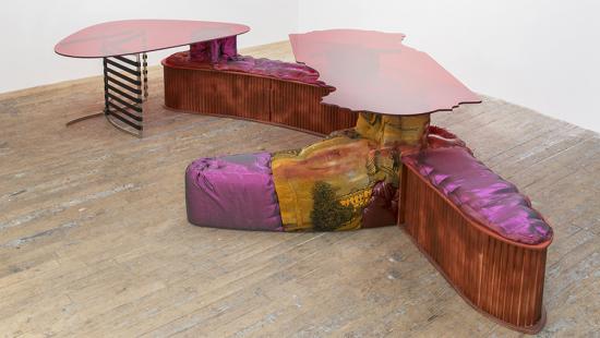 office table tops supported by multi-colored organic shapes