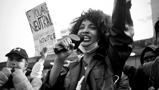People protesting and holding signs