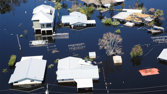 Aerial view of houses submerged in flood waters