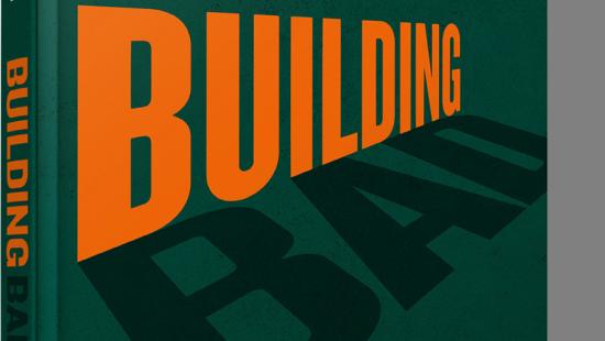 Orange and black lettering on a dark green background