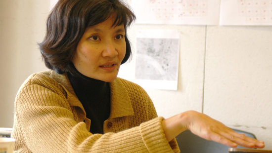 woman wearing a yellow cardigan