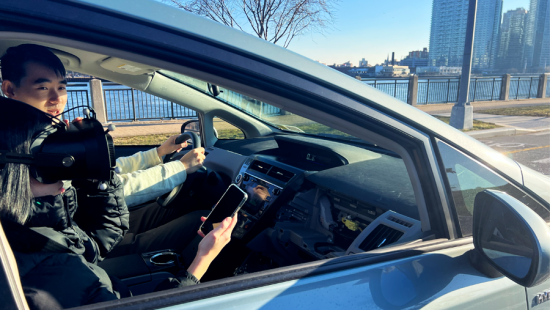 Two people sitting in a car irtual reality google and other tech.