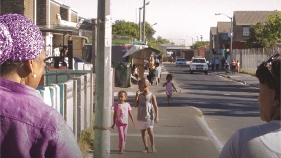 Women and children on an urban sidewalk
