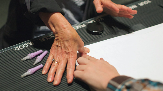 hands gesturing over a desk