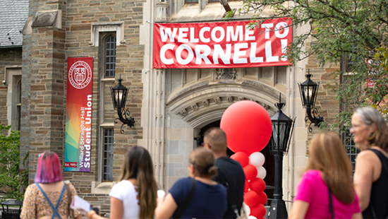 A banner welcoming students hangs over the student union entrance.