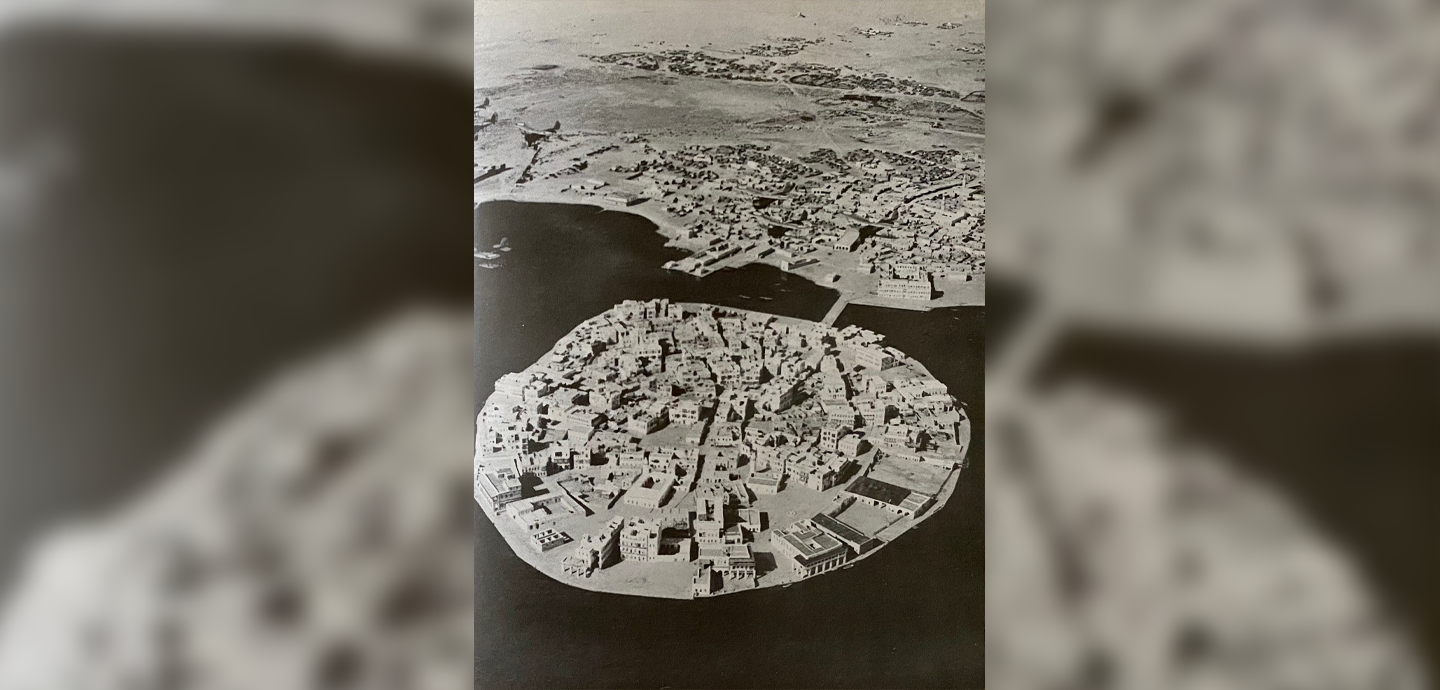 an aerial view of a circular island town.