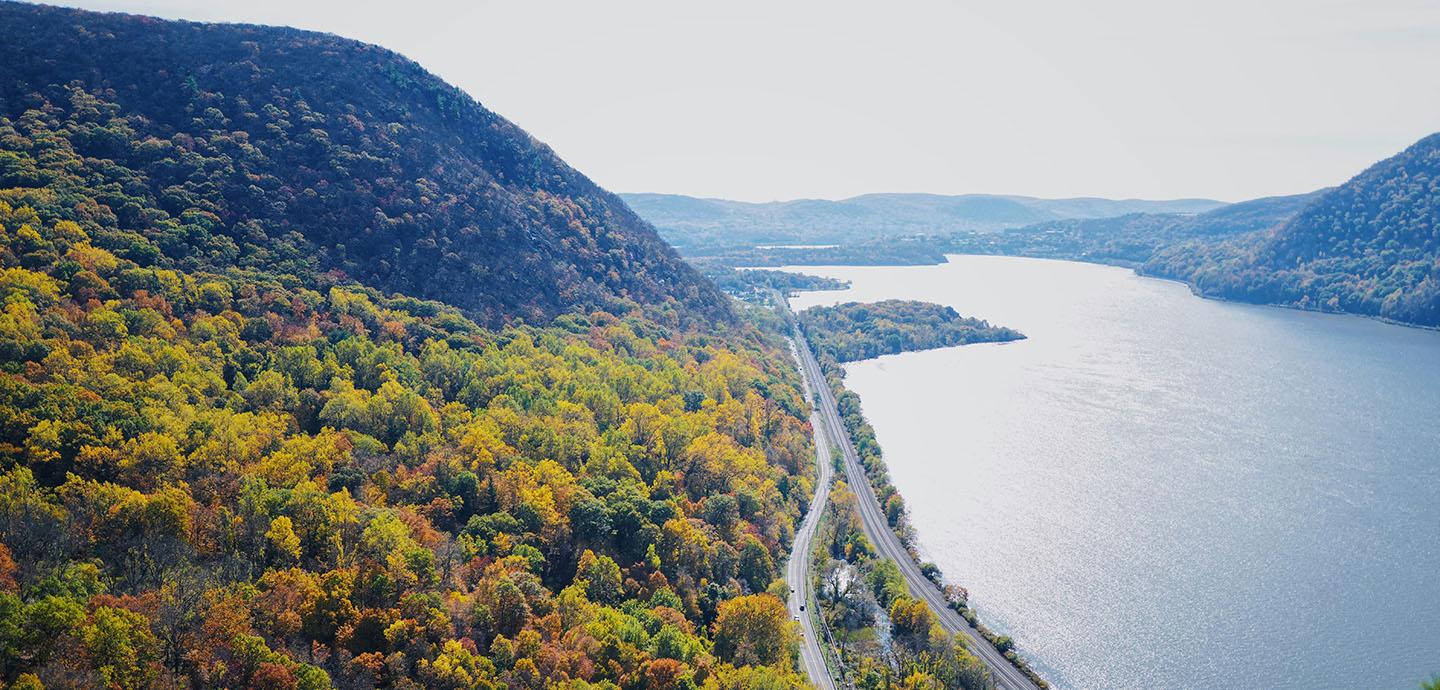 Aeriel view of a lake with a sloping hillside.