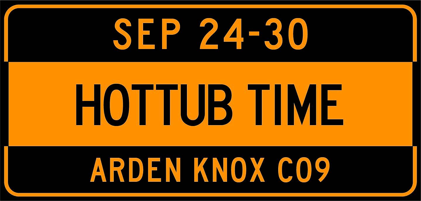 Black orange sign with artist name date and numbers