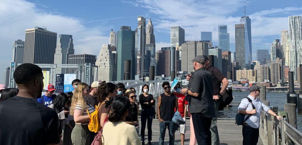 Professor Campanella and students on a pier in NYC.