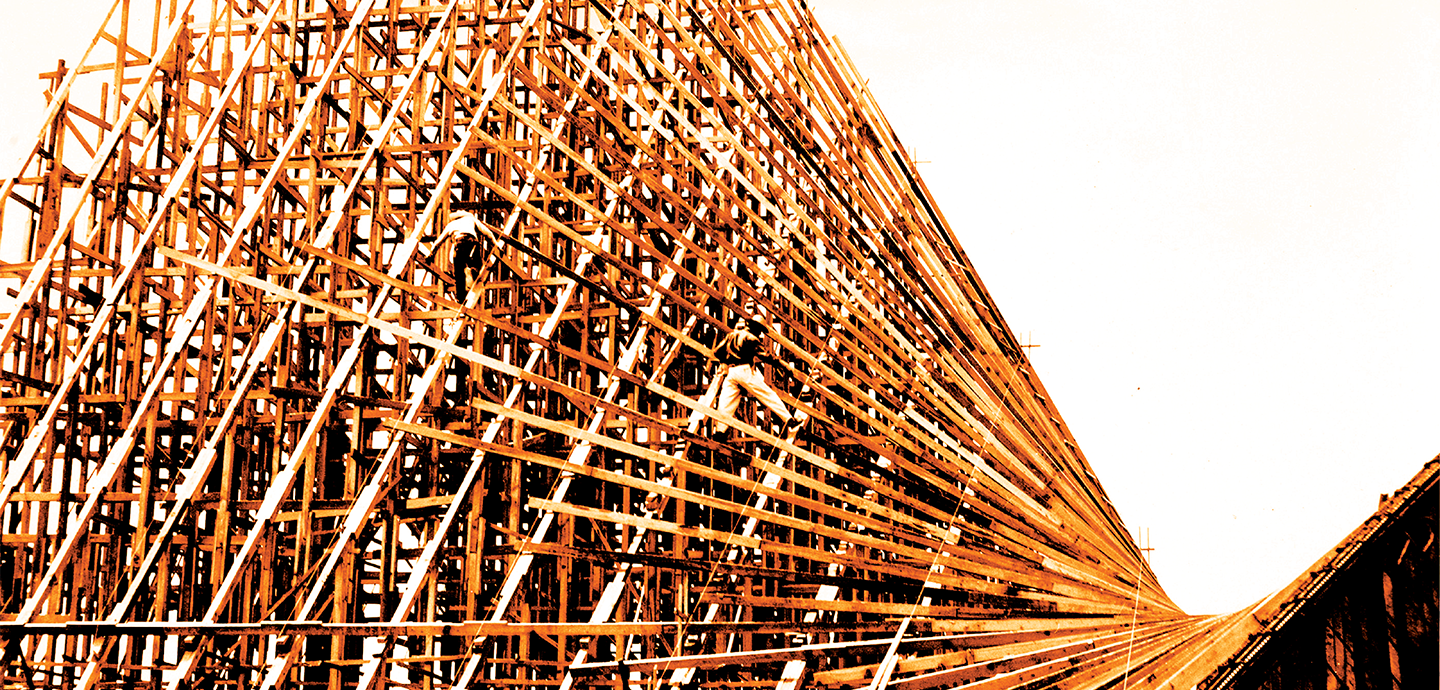 Wood formwork under construction with workers visible