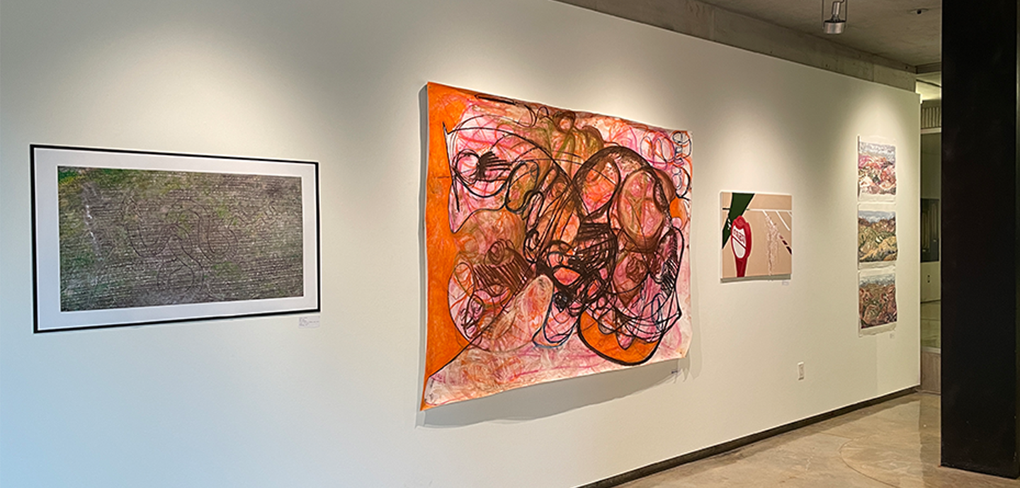 Six drawings, prints, and paintings mounted on a white gallery wall