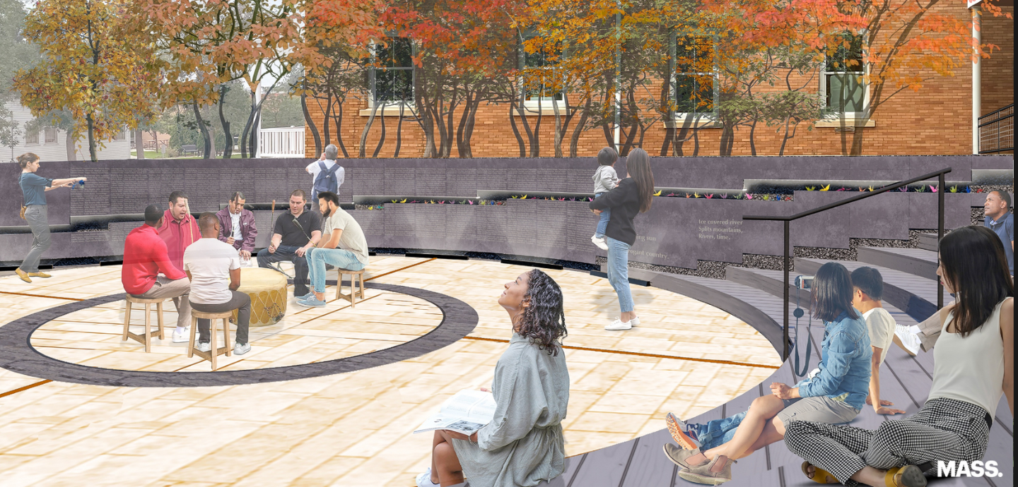people sitting around in a stone courtyard
