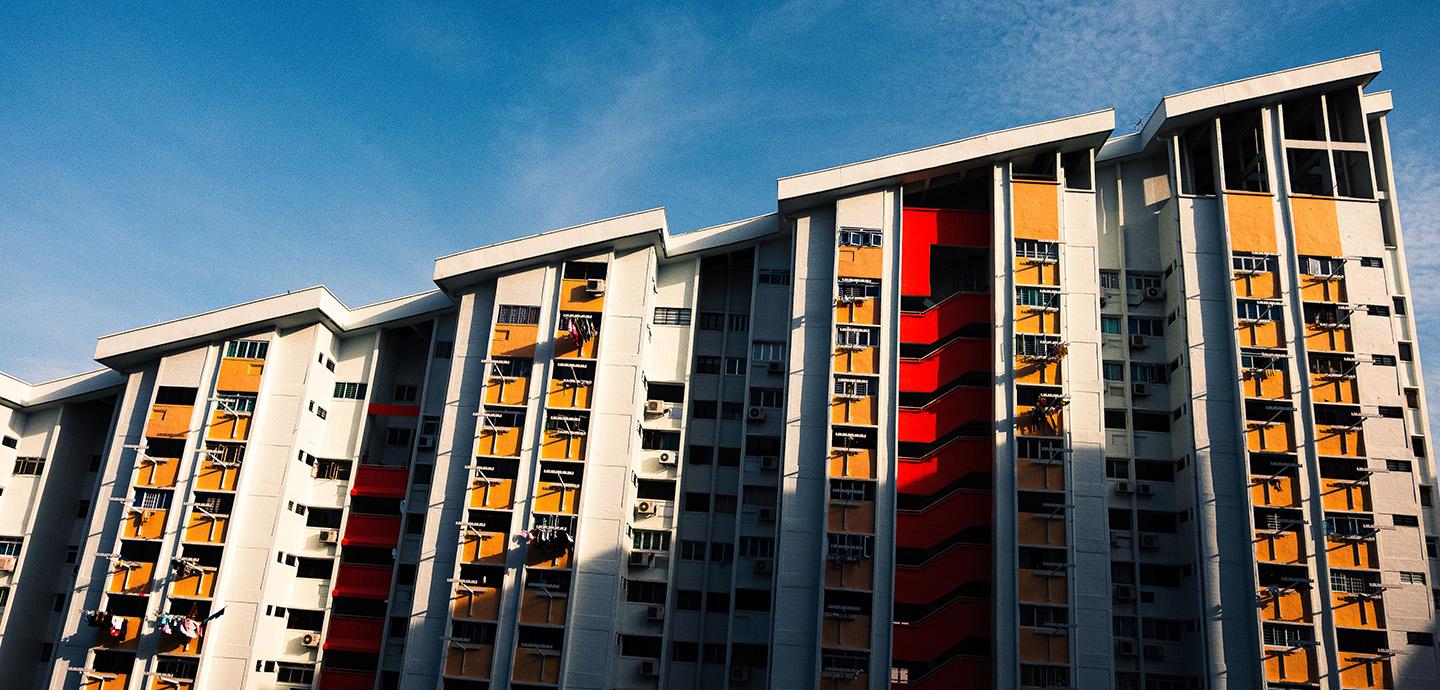apartment building with blue sky in background