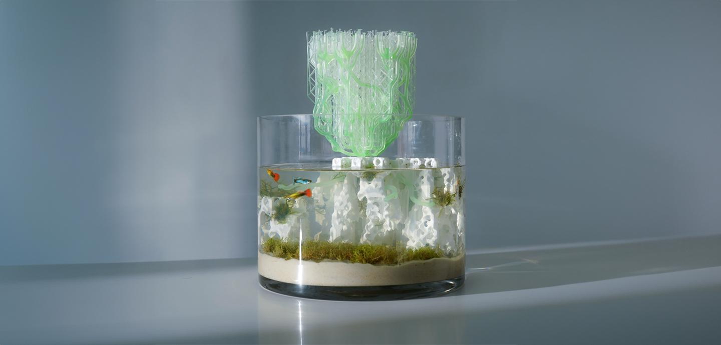 a large fishbowl with a 3d-printed component peaking out of the top