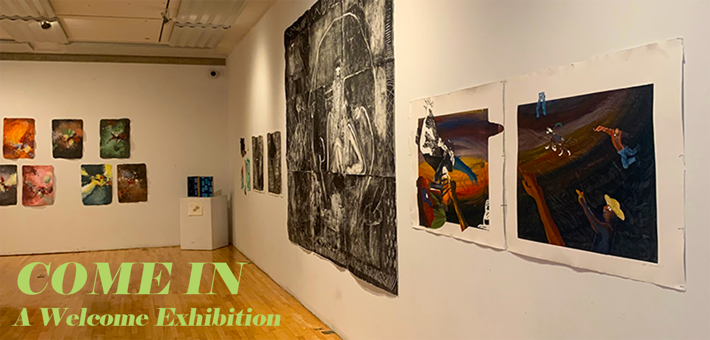 View of a white-walled gallery with light wood floor with multiple 2D rectangular artworks hung on the walls, in various sizes and colors. Text at the bottom of the image reads COME IN A Welcome Exhibition.