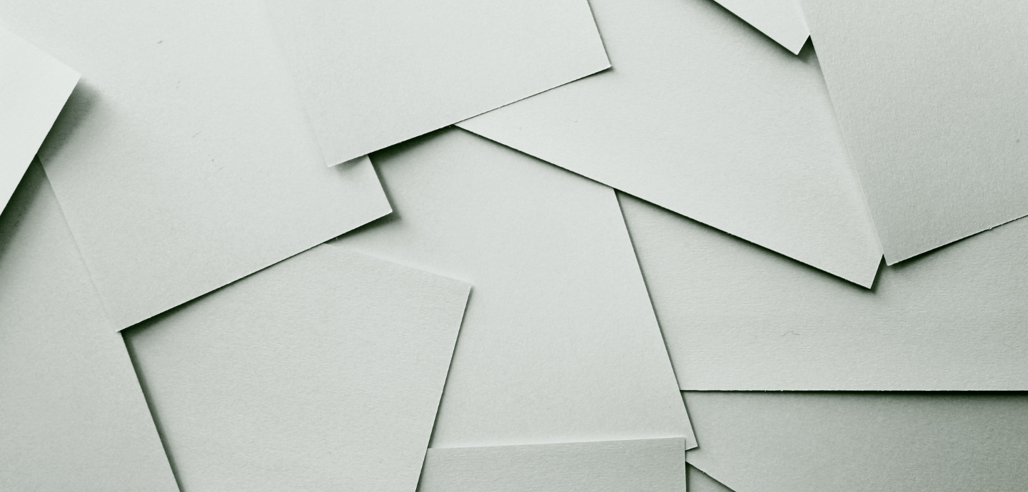An image of paper stacked on top of each other, but laying flat, to create an abstract effect