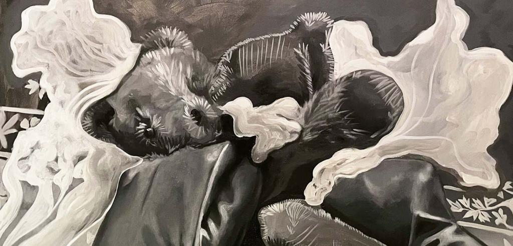 Black and white fuzzy teddy bear surrounded by different fabrics in gray and white.